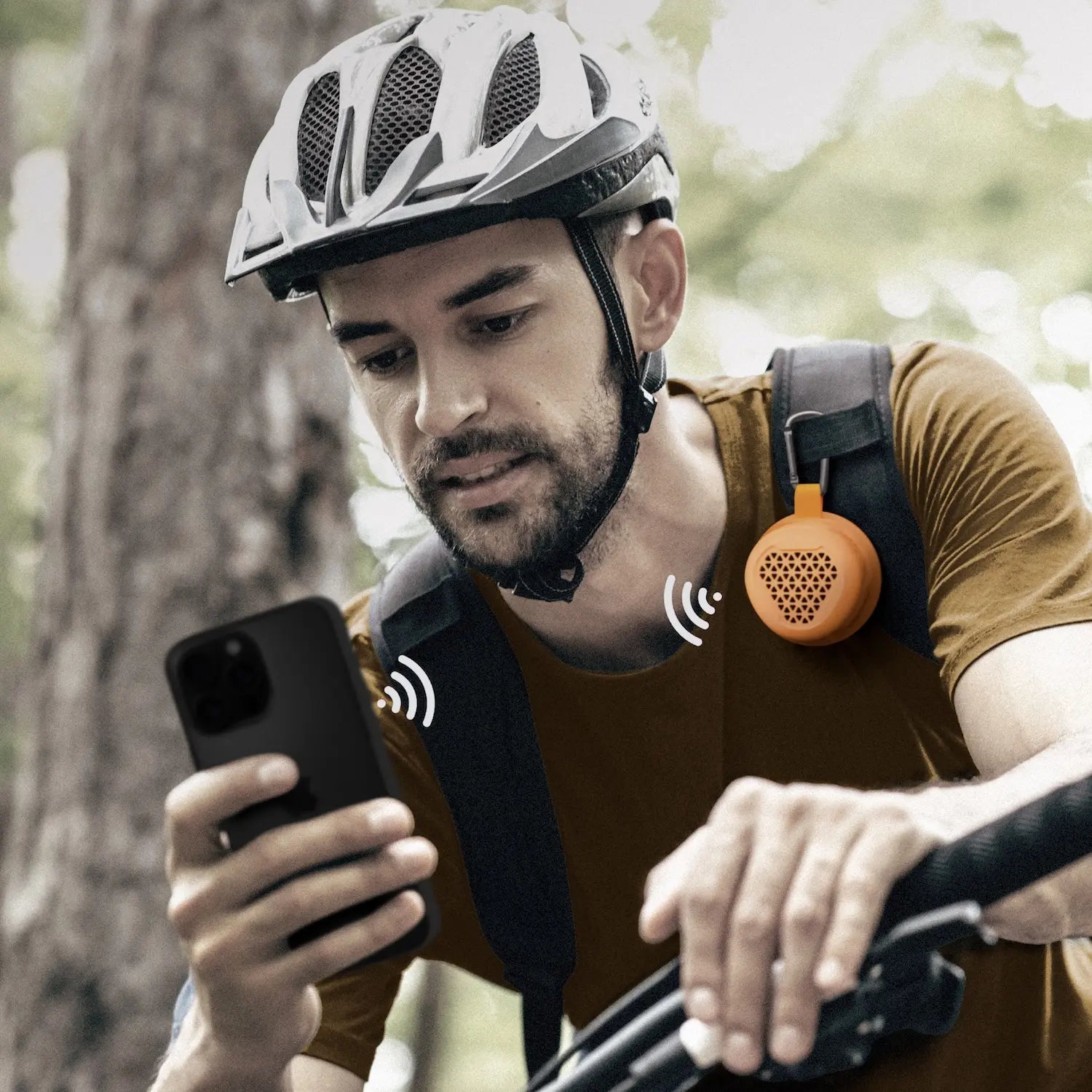 a man on a bike looking at his phone
