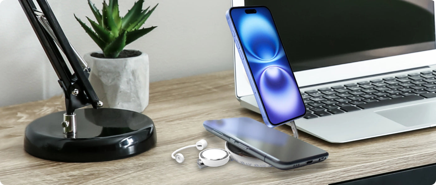 a cell phone and a laptop on a desk