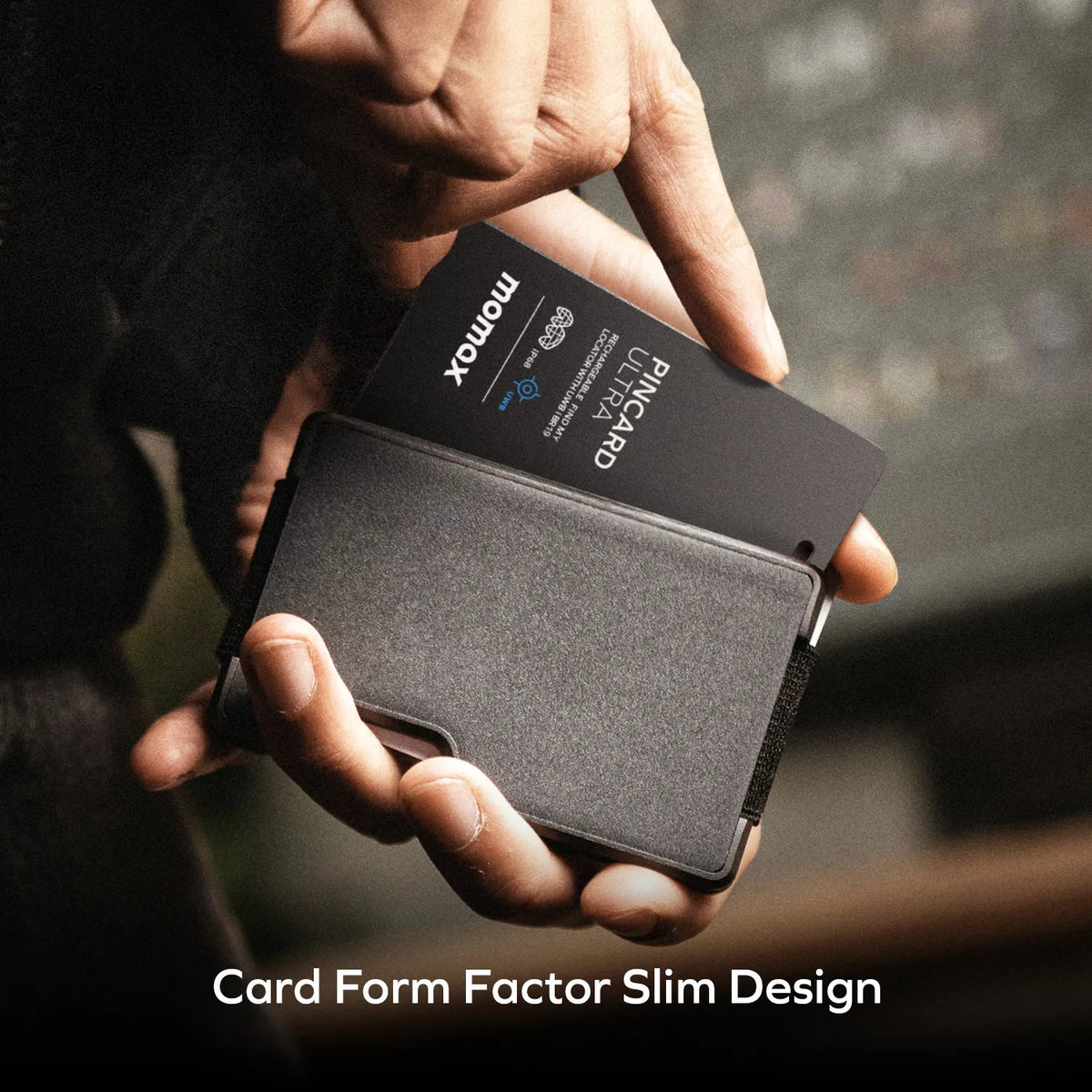 Momax PinCard Ultra slim credit card sized tracker sliding into a wallet, featuring a compact design for convenient everyday carry.